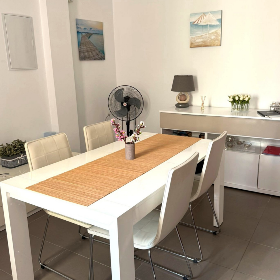 Dining area with table and tree chairs